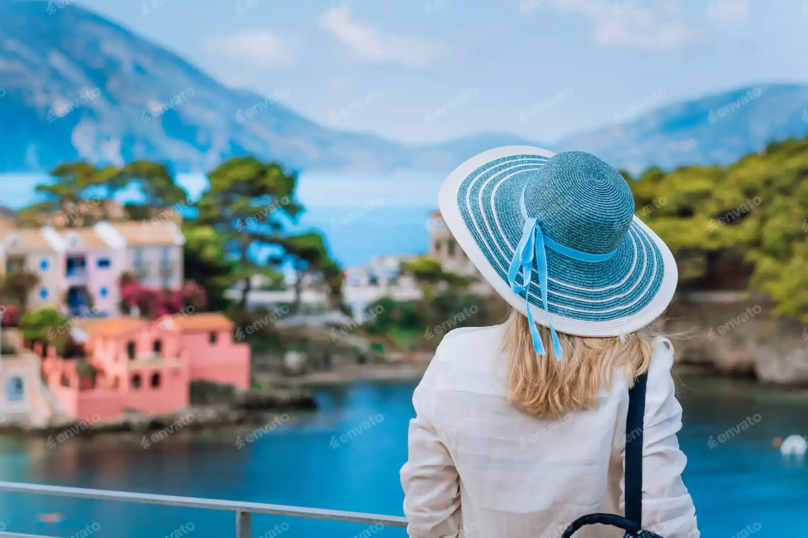 envato-tourist-woman-in-blue-sunhat-on-view-point-platfor-M9G38DP
